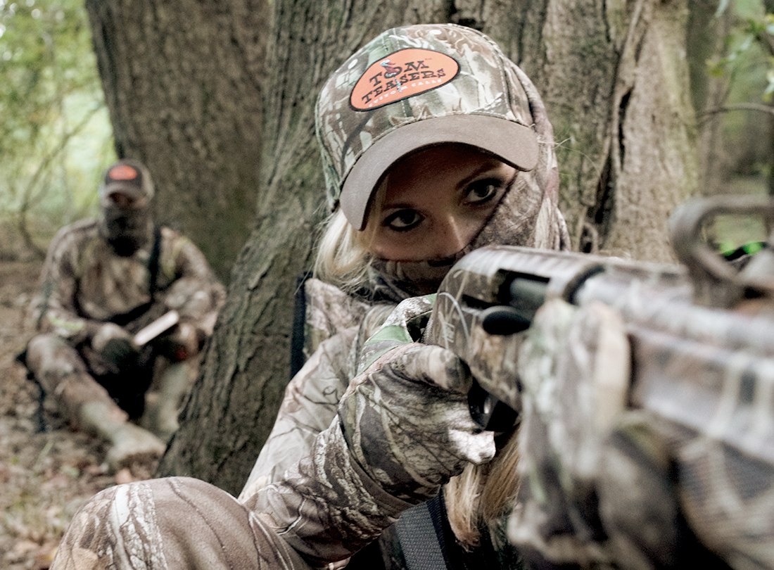 woman hunting while husband runs the calls